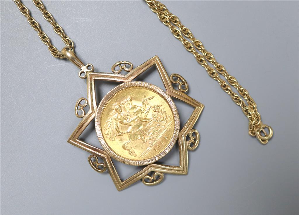 A 1932 gold sovereign, Pretoria Mint, in Star of David 9ct gold mount on yellow metal chain,